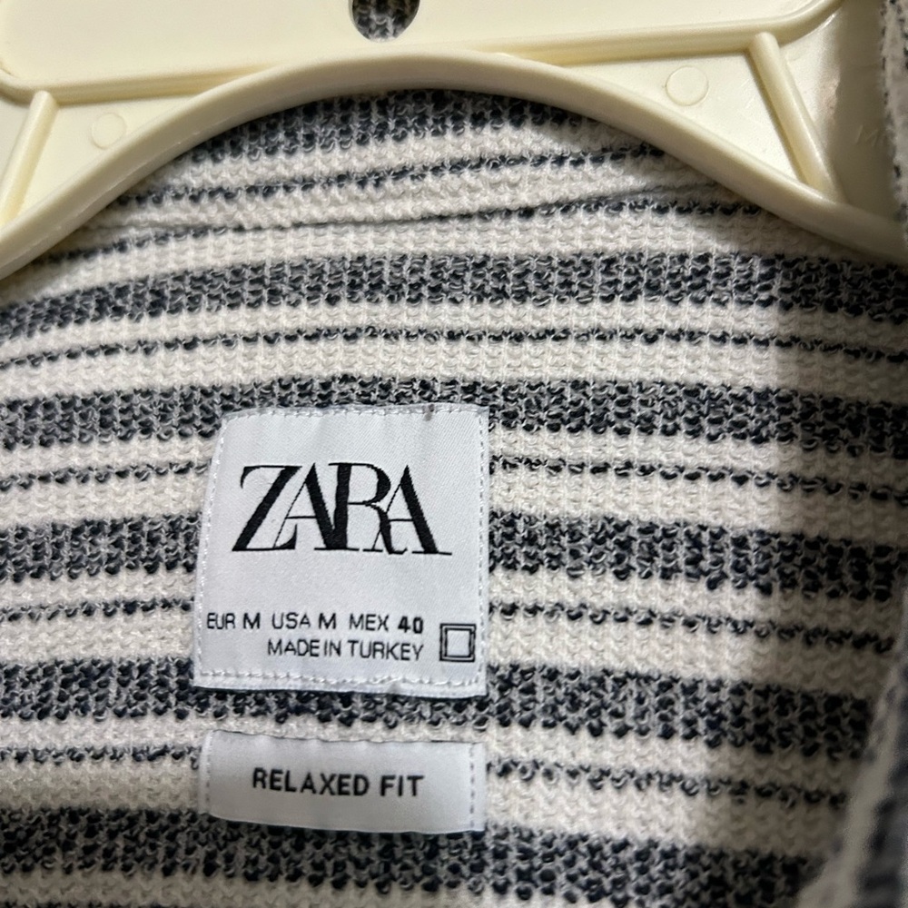 White and black strip short sleeve shirt, down buttons